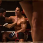 Cena do filme Coração de Lutador (2025), com Dwayne Johnson como Mark Kerr, recebendo orientações de sua equipe durante uma luta de MMA