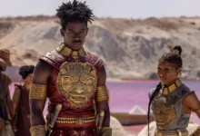 Damson Idris e Cynthia Erivo em cena de Filhos de Sangue e Osso (2027), usando armaduras cerimoniais em um cenário inspirado na cultura africana.
