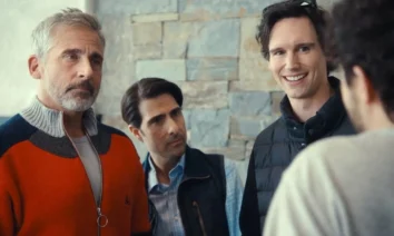 Cena do filme Mountainhead (2025), da HBO Max, com Steve Carell, Jason Schwartzman e Cory Michael Smith em destaque, em um ambiente interno com parede de pedra ao fundo