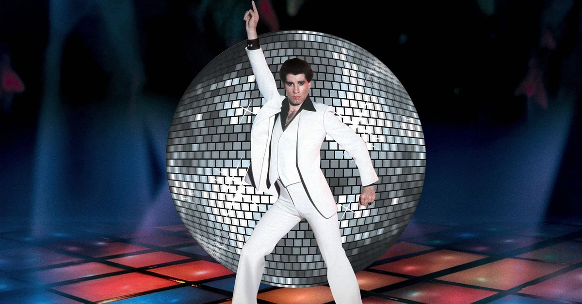 Cena icônica do filme Os Embalos de Sábado à Noite (1977), com John Travolta dançando sob luzes coloridas e globo espelhado — imagem destaque da matéria “As 5 músicas mais utilizadas em trilhas de filmes”