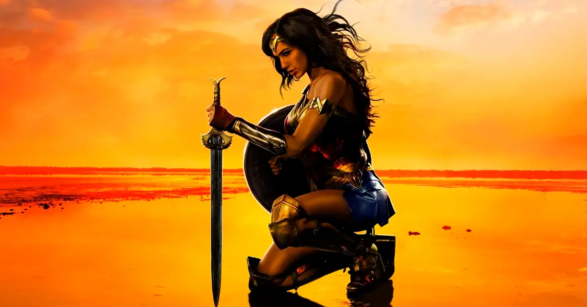 Gal Gadot como Mulher-Maravilha ajoelhada ao pôr do sol segurando uma espada — imagem relacionada às curiosidades de Mulher-Maravilha