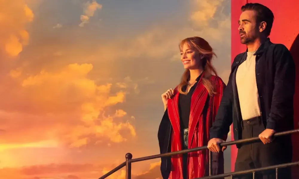 novo trailer de a grande viagem da sua vida Cena do filme A Grande Viagem Da Sua Vida com Margot Robbie e Colin Farrell no pôr do sol, destaque do novo trailer de A Grande Viagem Da Sua Vida.