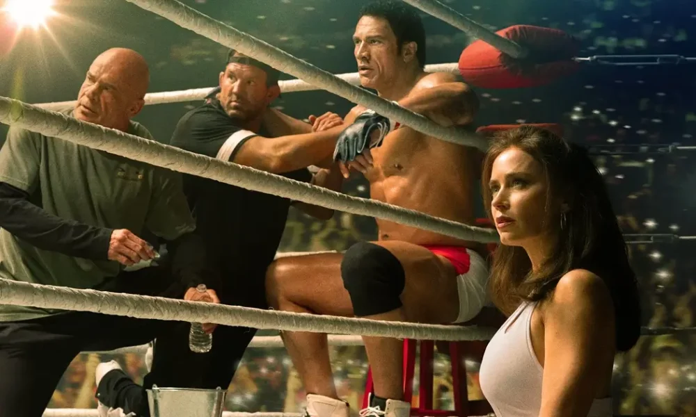 Bas Rutten, Ryan Bader, Dwayne Johnson como Mark Kerr e Emily Blunt como Dawn Staples em Coração de Lutador - The Smashing Machine (2025).