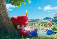 Mario observa paisagem colorida do Reino dos Cogumelos em cena oficial de Super Mario Galaxy O Filme 2026