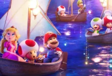 Cena colorida do trailer de Super Mario Galaxy, mostrando Mario, Princesa Peach e Toads navegando em barcos iluminados sob um céu estrelado no novo filme da Universal Pictures, com estreia em 3 de abril de 2026.