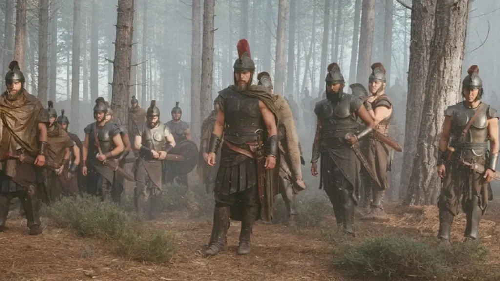 Matt Damon como Odisseu liderando exército grego em floresta enevoada em A Odisseia, filme de Christopher Nolan em 2026