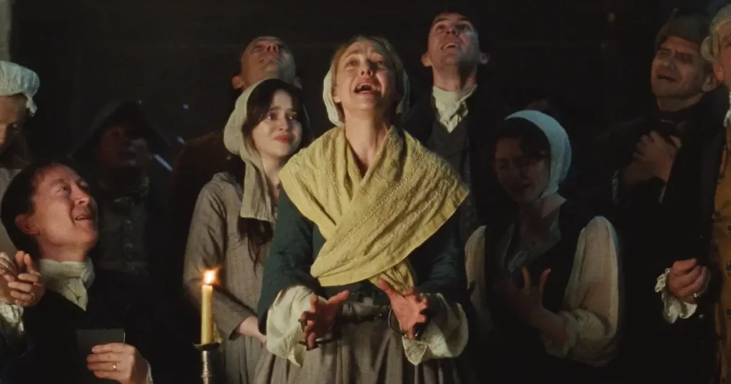 apostas oscar 2026 o testamento de ann lee Amanda Seyfried ao lado de Matthew Beard, Viola Prettejohn, Christopher Abbott e Thomasin McKenzie em cena intensa do musical histórico O Testamento de Ann Lee (2025), apontado como um dos filmes nas apostas do Oscar 2026.