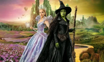 Cynthia Erivo e Ariana Grande em Wicked Parte 2, principal destaque das estreias de 20 de novembro de 2025, posando na estrada de tijolos amarelos com a Cidade Esmeralda ao fundo