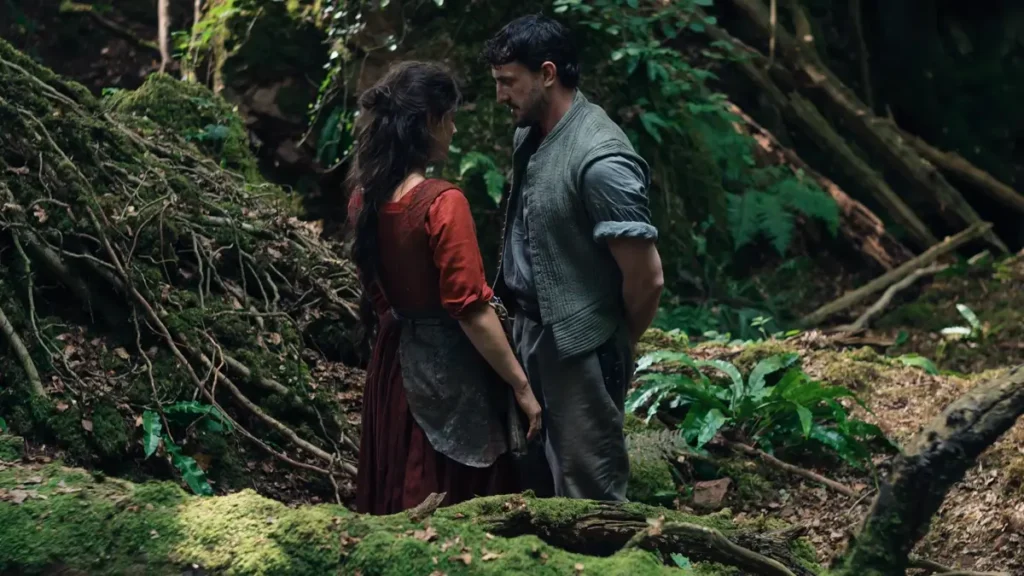 Jessie Buckley e Paul Mescal em cena de floresta em Hamnet A Vida Antes de Hamlet (2025), drama de época dirigido por Chloé Zhao entre os filmes 2026