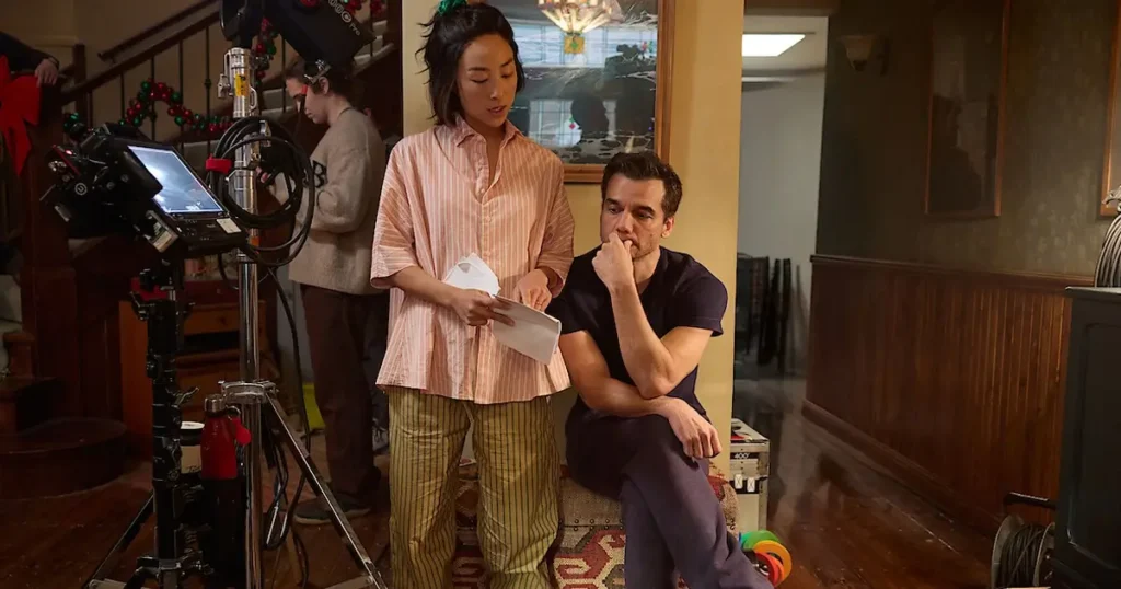 Wagner Moura e Greta Lee conversam nos bastidores do filme 11817, um aguardado suspense da Netflix em 2026.