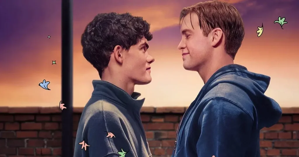 Kit Connor e Joe Locke como Nick e Charlie se olhando ternamente ao pôr do sol com folhas ilustrativas flutuando em Heartstopper Forever, filme de Heartstopper em 2026