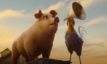 Porco e galo discursam sobre o celeiro em cena do trailer de A Revolução dos Bichos (2026), animação dirigida por Andy Serkis baseada na obra de George Orwell.