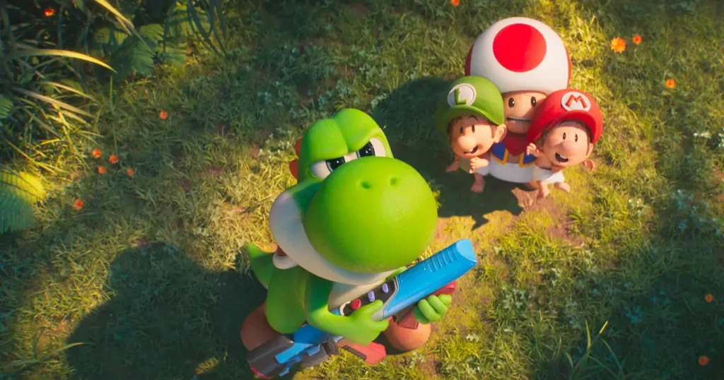 Yoshi segurando uma arma laser enquanto Baby Mario, Baby Luigi e Toad observam o céu em cena do novo trailer de Super Mario Galaxy: O Filme.