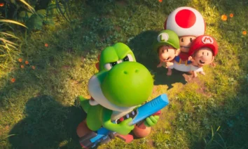 Yoshi segurando uma arma laser enquanto Baby Mario, Baby Luigi e Toad observam o céu em cena do novo trailer de Super Mario Galaxy: O Filme.