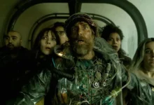 Sam Rockwell, Michael Peña, Juno Temple, Haley Lu Richardson, Asim Chaudhry e Zazie Beetz em cena de Boa Sorte, Divirta-se, Não Morra (2025)