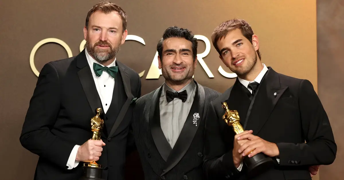 Kumail Nanjiani com Jack Piatt e Sam A. Davis após vitória por “Os Cantores” em um dos empates na história do Oscar 2026