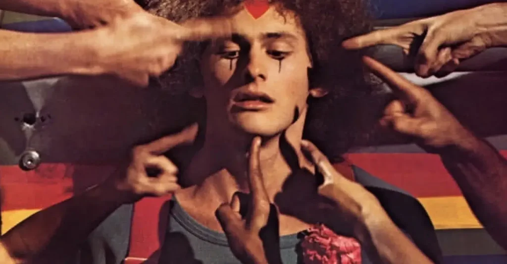 Victor Garber como Jesus em Godspell (1973), musical colorido ambientado na Nova York dos anos 70 inspirado na contracultura