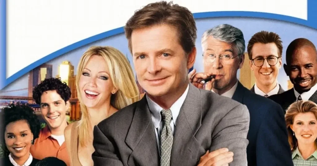 Michael J. Fox em Spin City (1996–2000), série que marcou a transição de sua carreira durante o início do Parkinson.
