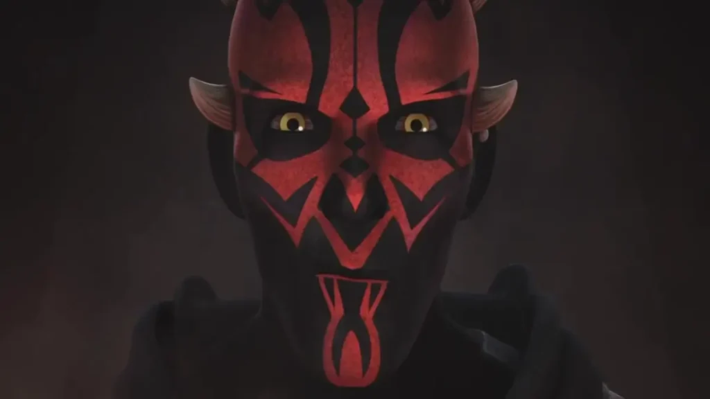 Close do rosto de Darth Maul destacando tatuagens Sith vermelhas e pretas em Star Wars