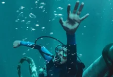Austin Abrams em cena de Dentro da Baleia (Whalefall), suspense de 2026 sobre um mergulhador preso dentro de uma baleia, com estreia em 15 de outubro de 2026.