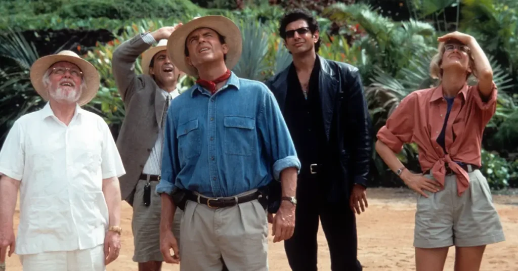 John Hammond, Donald Gennaro, Alan Grant, Ian Malcolm e Ellie Sattler observam os dinossauros em Jurassic Park (1993).