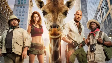 Jack Black, Karen Gillan, Dwayne Johnson e Kevin Hart ao lado de uma girafa em imagem promocional de Jumanji: Mundo Real (2026).