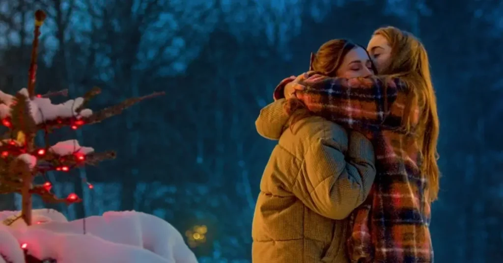 Felice Jankell e Happy Jankell se abraçam em uma cena de Transformação de Natal, comédia romântica natalina da Netflix.